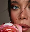 Woman Covering Her Face With Pink and White Textile