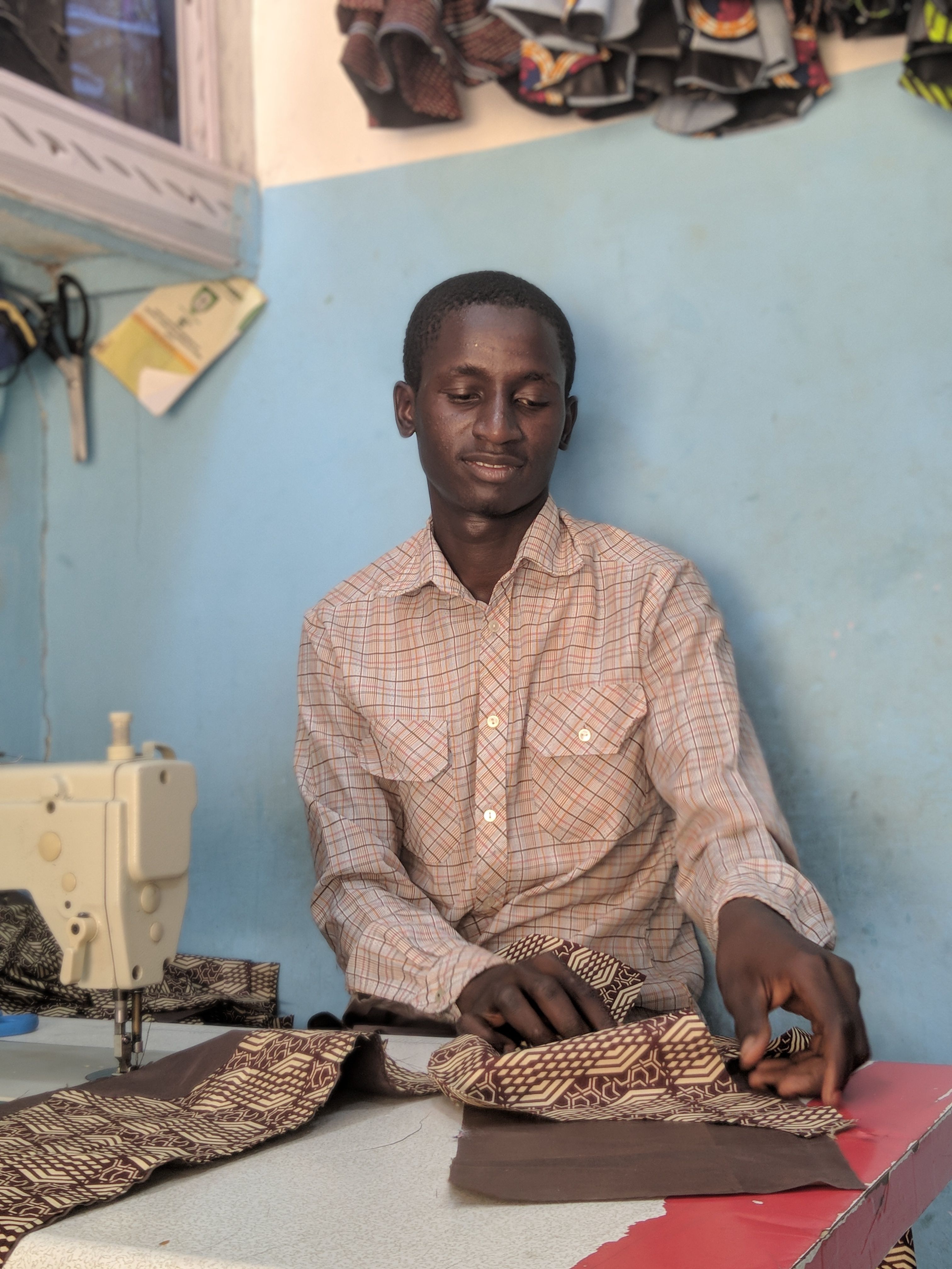 Photo of a Man Sewing · Free Stock Photo