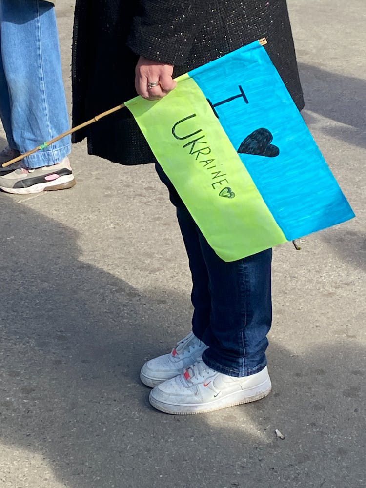 Woman Holding Ukraine Flag On Anti War Demonstration