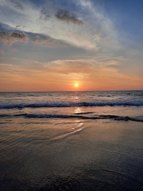 Ocean Waves Crashing on Shore during Sunset