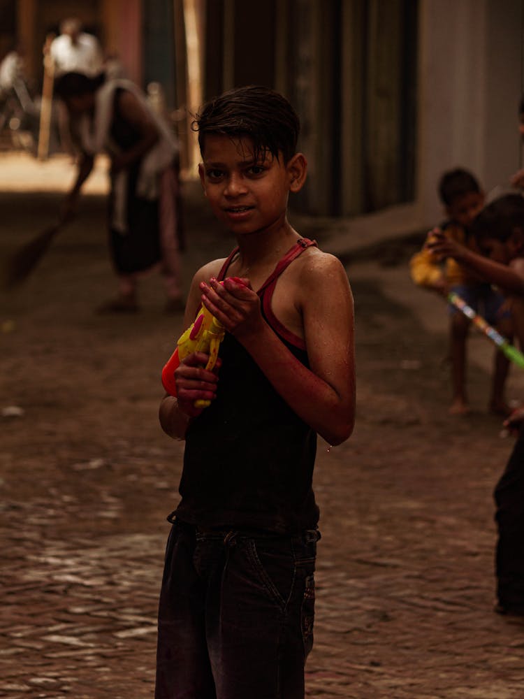 Boy Holding A Water Gun