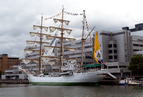 Ship with Masts Moored in City