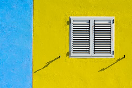Free Exterior with a Window with Closed Shutters  Stock Photo