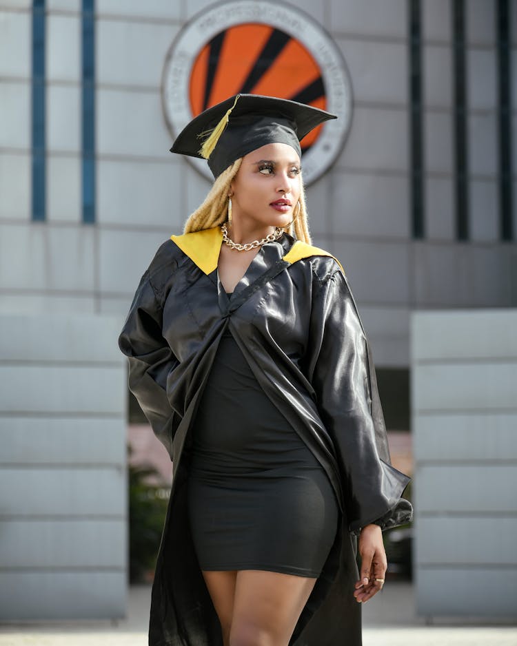 Woman Wearing A Graduation Gown And Cap