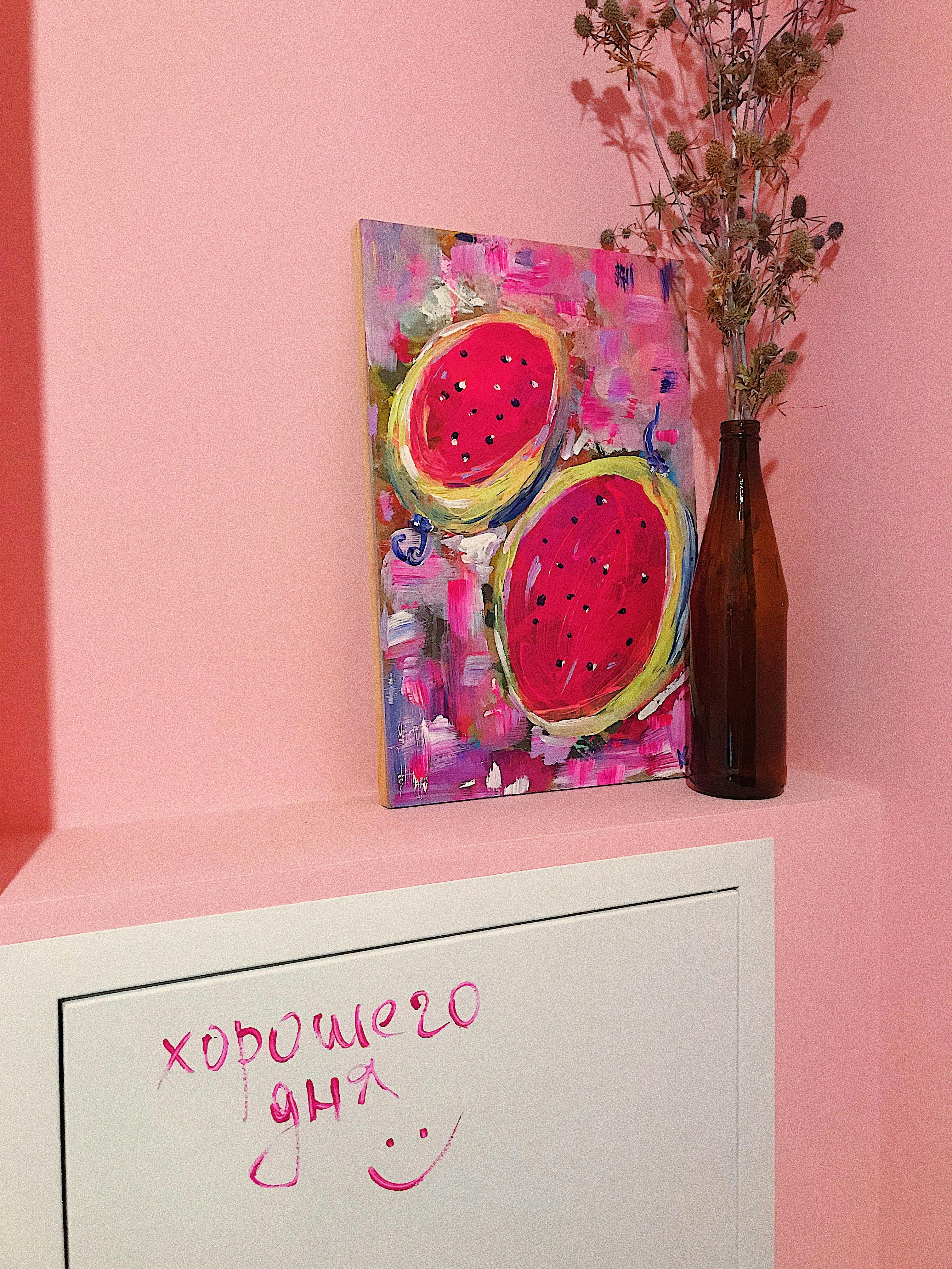 Vibrant acrylic painting of fruit with dry flowers in a bottle and cheerful message.