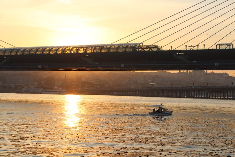 Boat On Sea Under Bridge