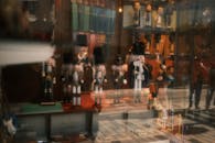 Character Figures Displayed Behind Glass Panel