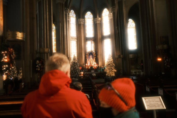 People In Cathedral Decorated For Christmas