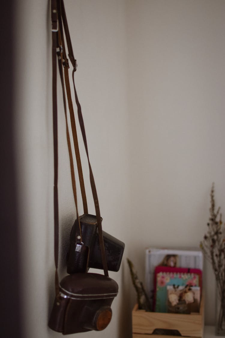 Retro Camera Bags Hanging On A Wall