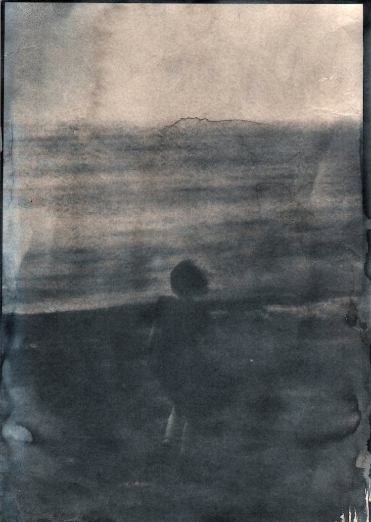 Blurry View Of Woman In Dress Standing At Seashore In Cyanotype Technique