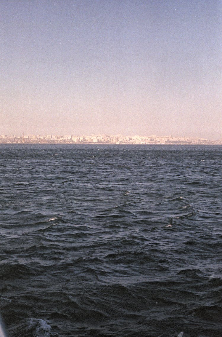 View From Sea Of Distant City On Shore