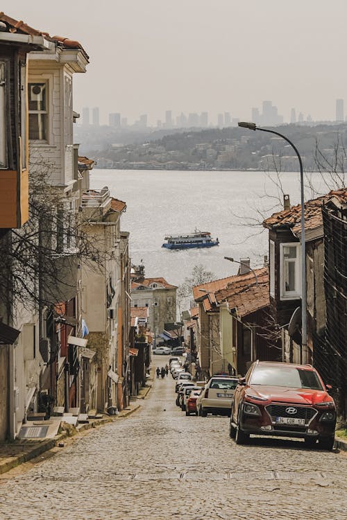 Cars Parked Beside the Houses Near the Sea