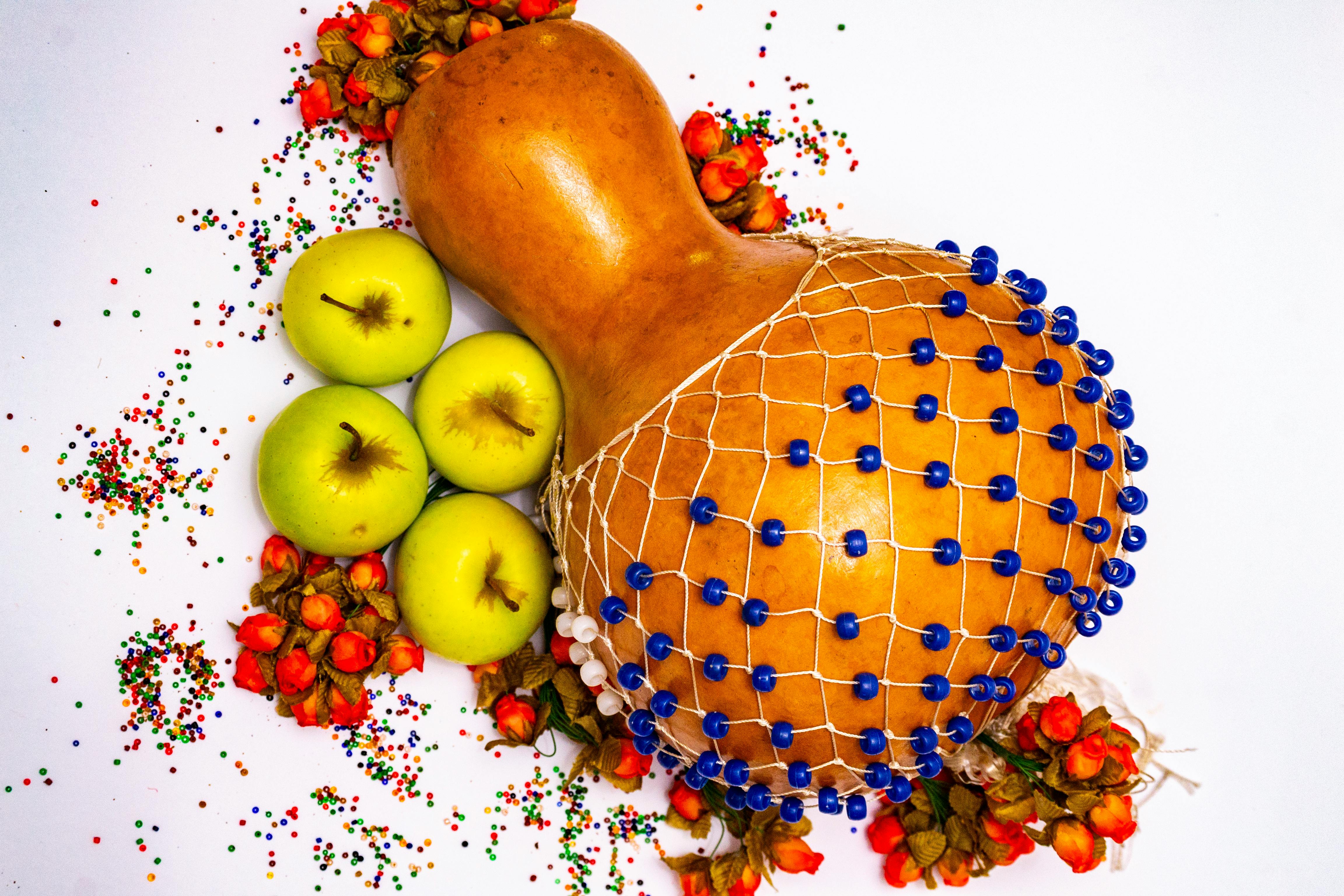 Beaded Gourd Rattle and Fruit Composition · Free Stock Photo