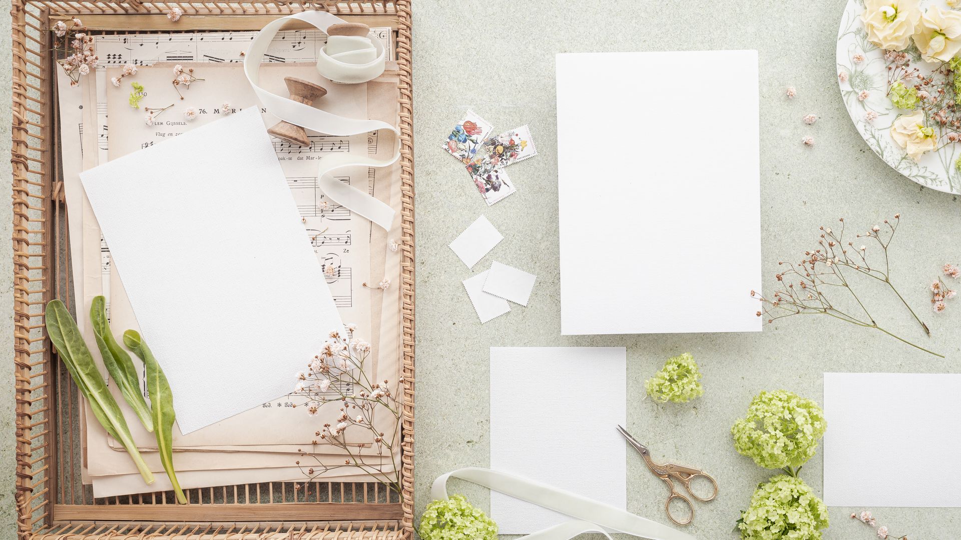 Invitation Cards: Elevate Your Events with Custom Designs 7 Artistic flat lay with floral elements, blank paper, and music sheets, perfect for creative projects — invitation cards