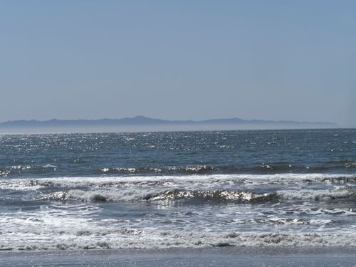 Free Serene summer seascape with waves crashing on San Diego beach, California. Stock Photo