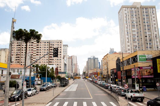 Vibrant city street scene in Brazil featuring tall buildings and urban life.