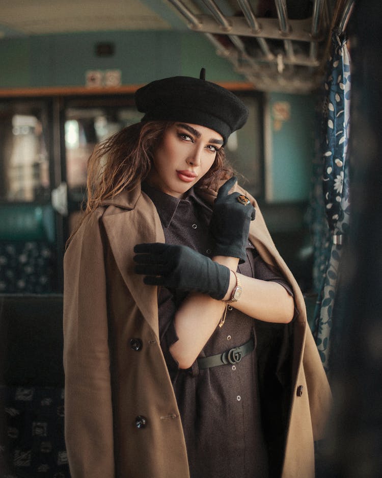 Woman Posing In Coat And Hat