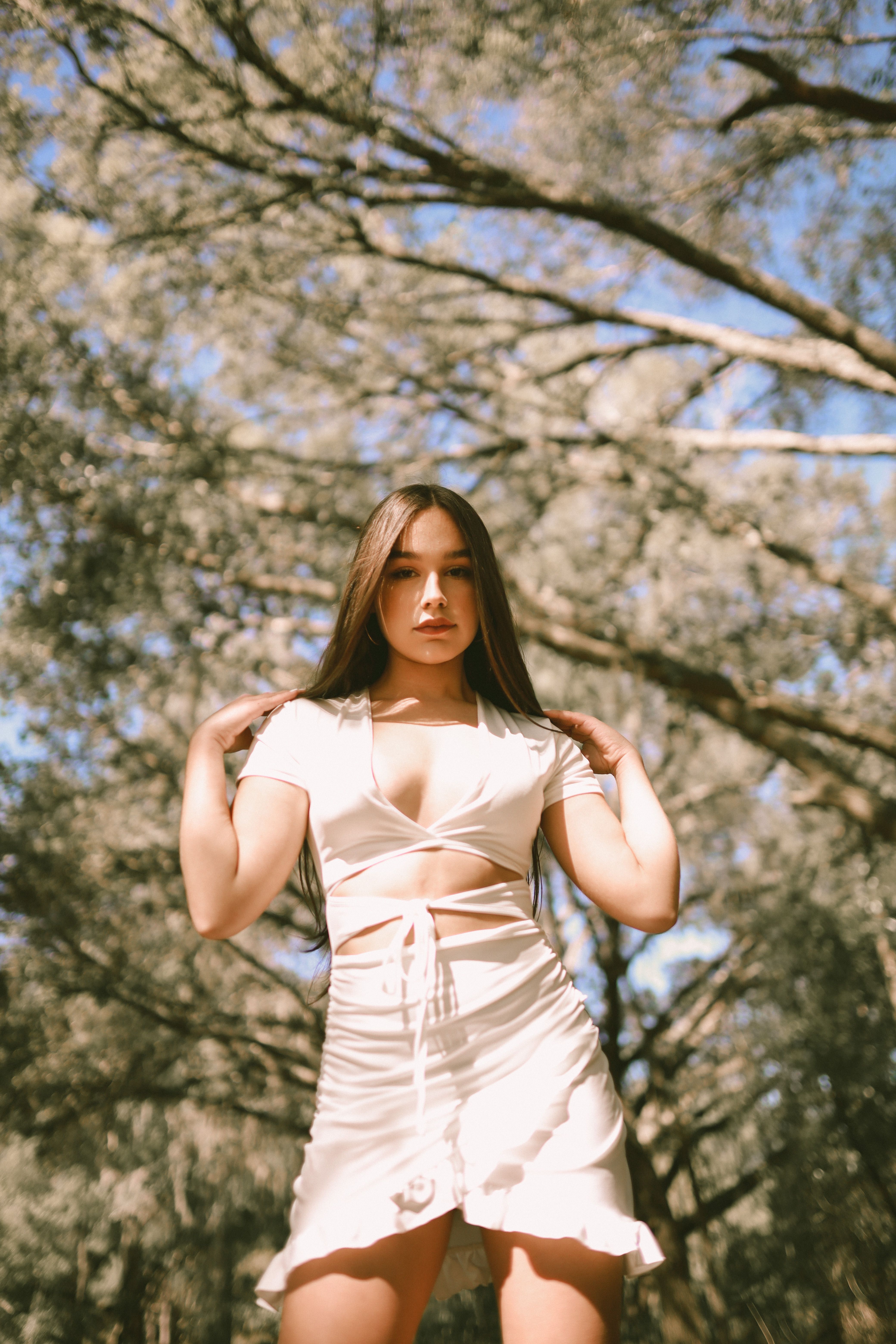 Woman Posing under Trees · Free Stock Photo