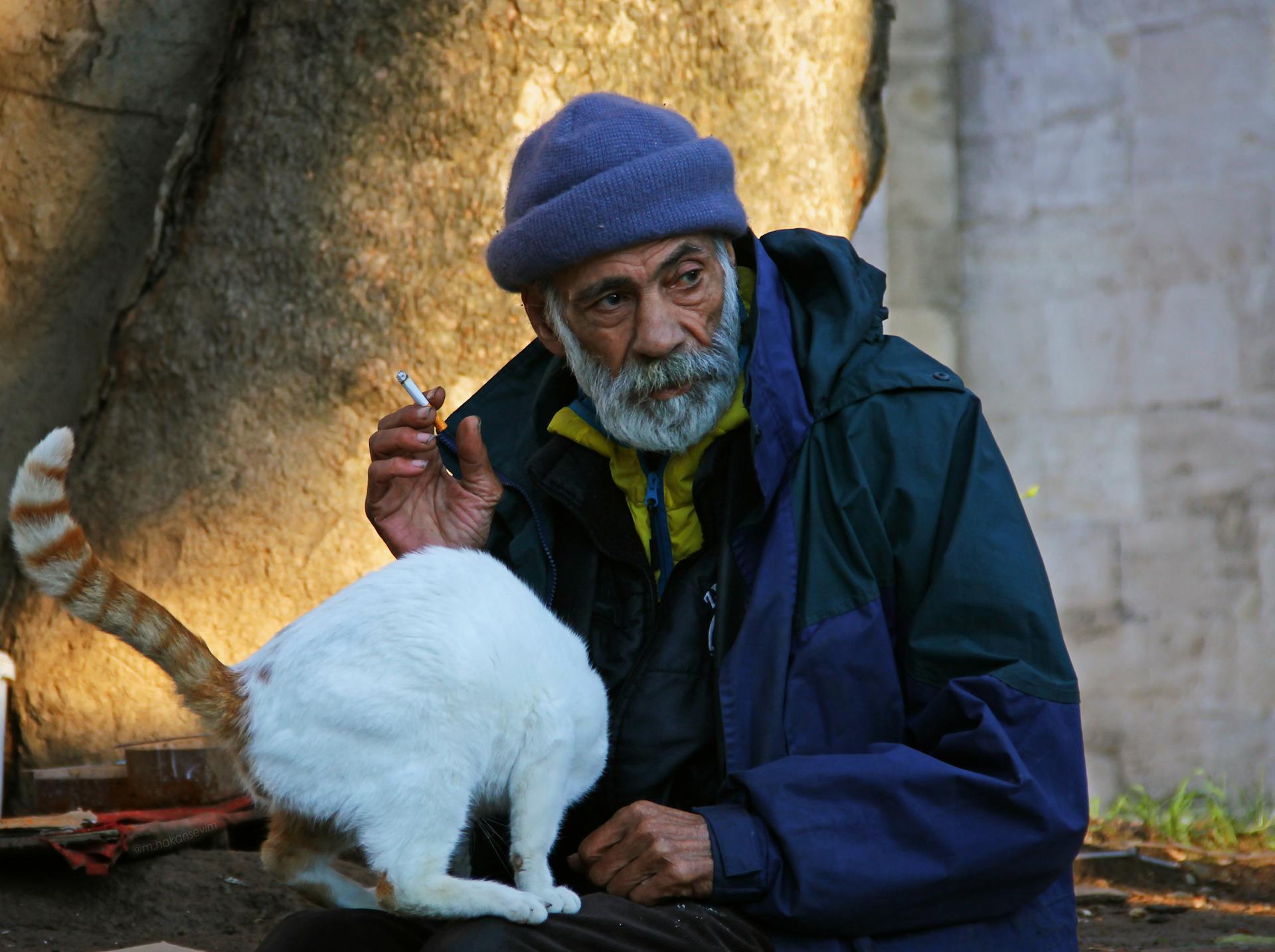 Man Smoking Cigarette with Cat