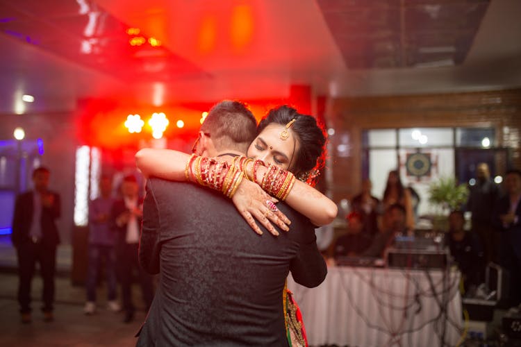 Couple Hugging On Party