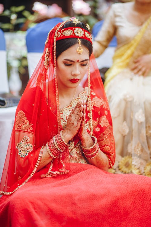 Bride in Traditional Clothing Praying