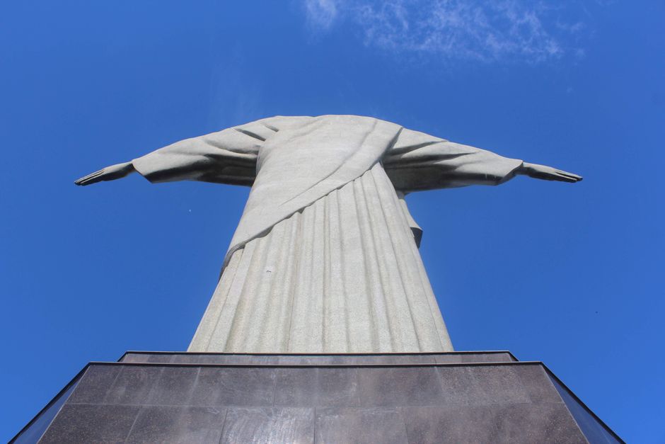 Low angle view of Christ the Redeemer statue with clear blue sky in Rio de Janeiro.