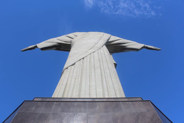 Low Angle View Of Statue Holding Out Arms