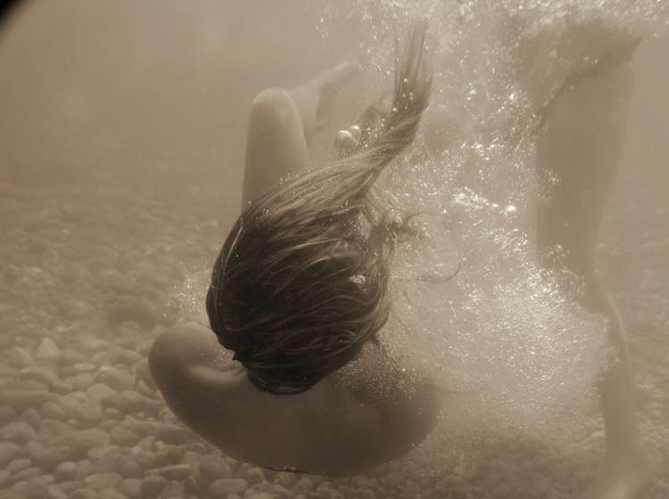 Woman Floating In Water