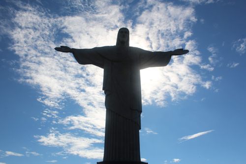 Free Silhouette of Christ the Redeemer against a bright morning sky in Rio de Janeiro. Stock Photo
