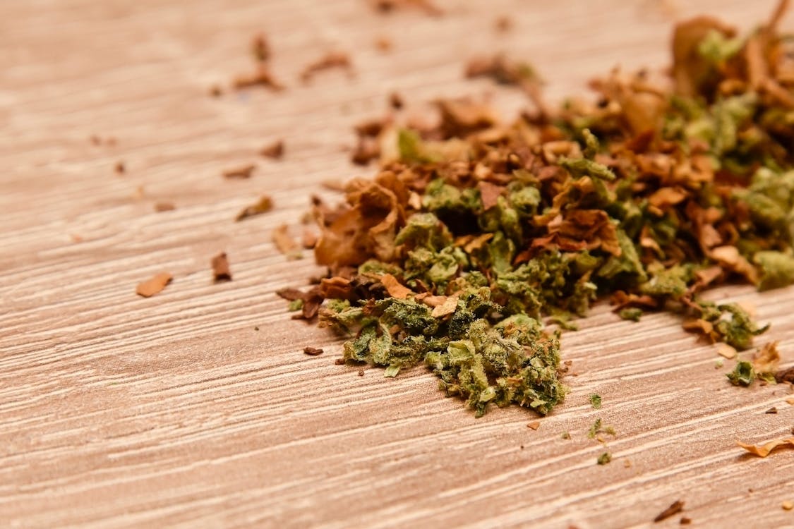 Free Grinded Dried and Fresh Marijuana Leaves Stock Photo