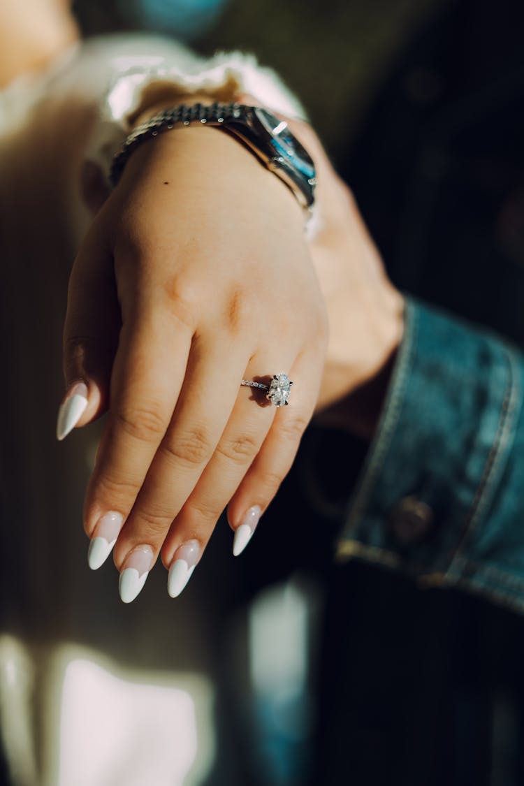 Woman Hand With Nail Tips And Ring On Finger