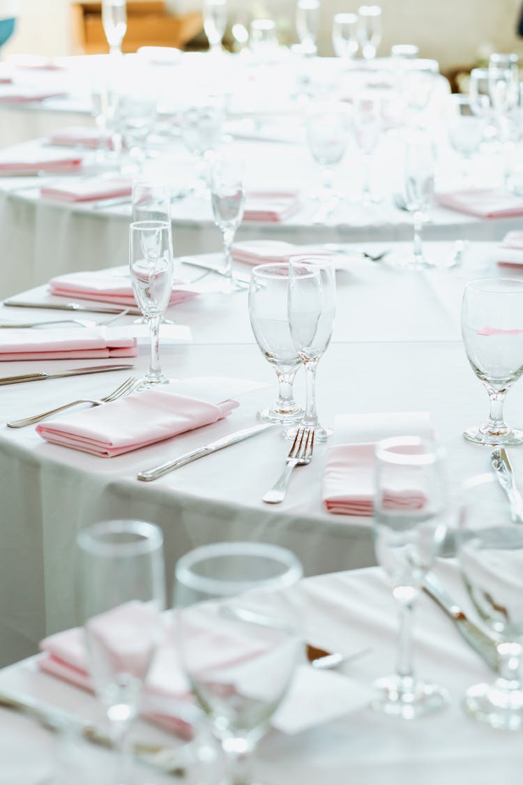 Round Tables Arranged In White And Pink For Wedding Party