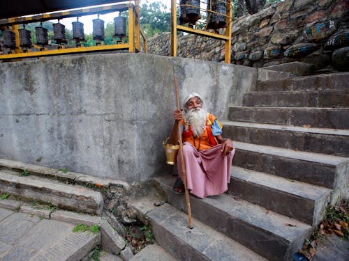 Old Man Sitting on Stairs