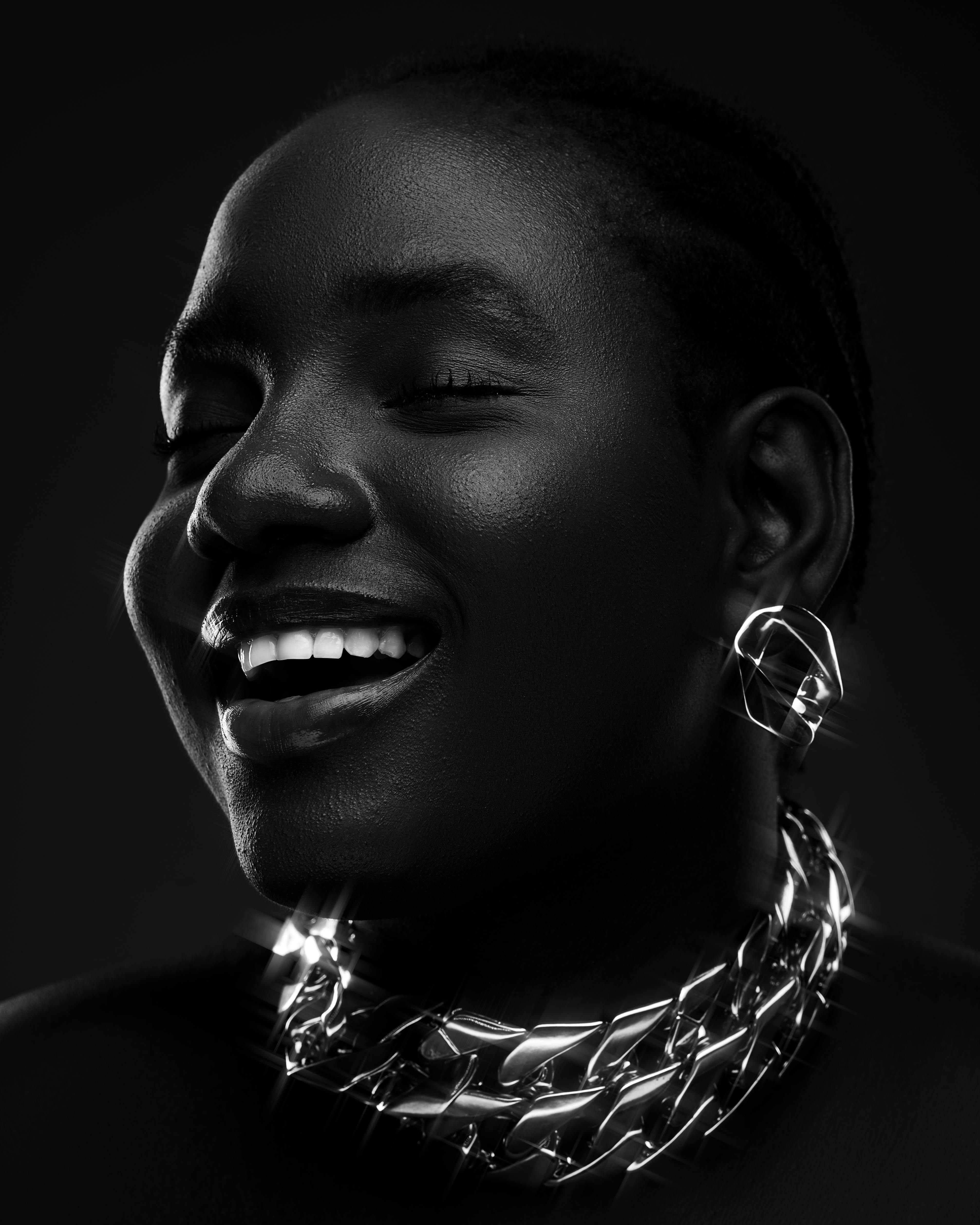 woman wearing shiny chain and smiling