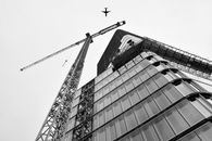 Crane and building under construction , modern