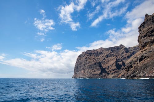 Brown Rock Formation on the Ocean