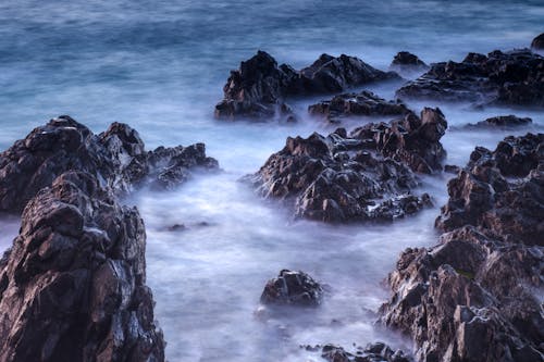 Free Waves on Rocky Coast Stock Photo