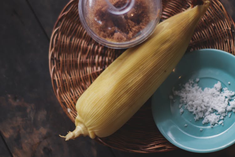 Yellow Corn On Brown Rattan Plate