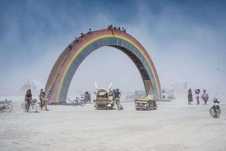 People Walking On The Rainbow Bridge During The Burning Man Festival In Nevada, United States