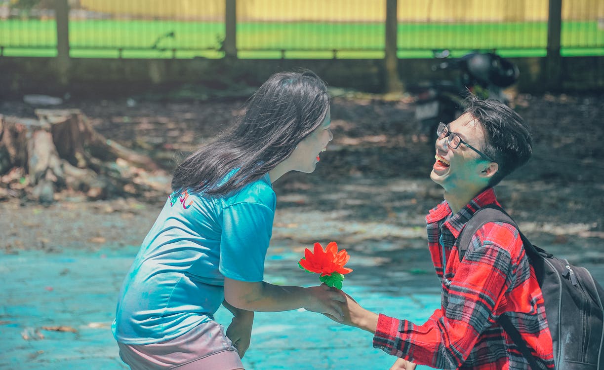 Photography of a Man And Woman Laughing