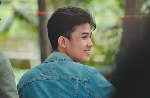 Close-Up Photo of Man Wearing Denim Jacket