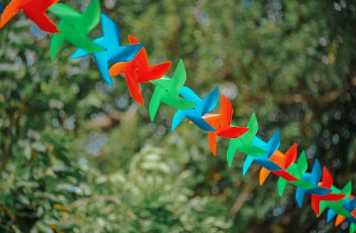 Selective Focus Photography of Pinwheels on String