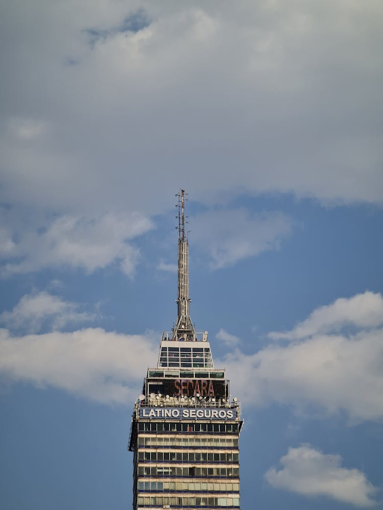 A Latino Seguros Building Under White Clouds