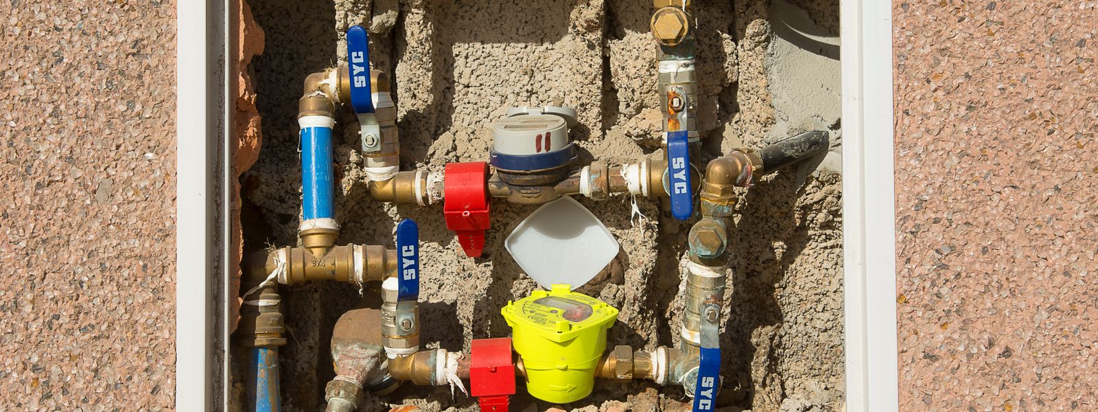 Water meters and supply lines in a wall