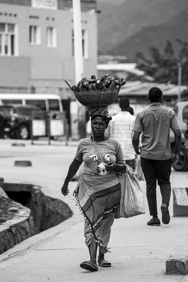 Woman With A Basket On Her Head