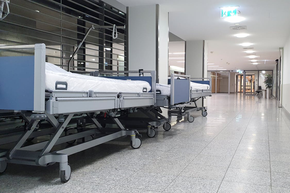 Free Hospital Beds in the Hallway Stock Photo
