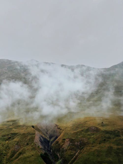 Top View From Behind the Clouds of Mountain Landscape 