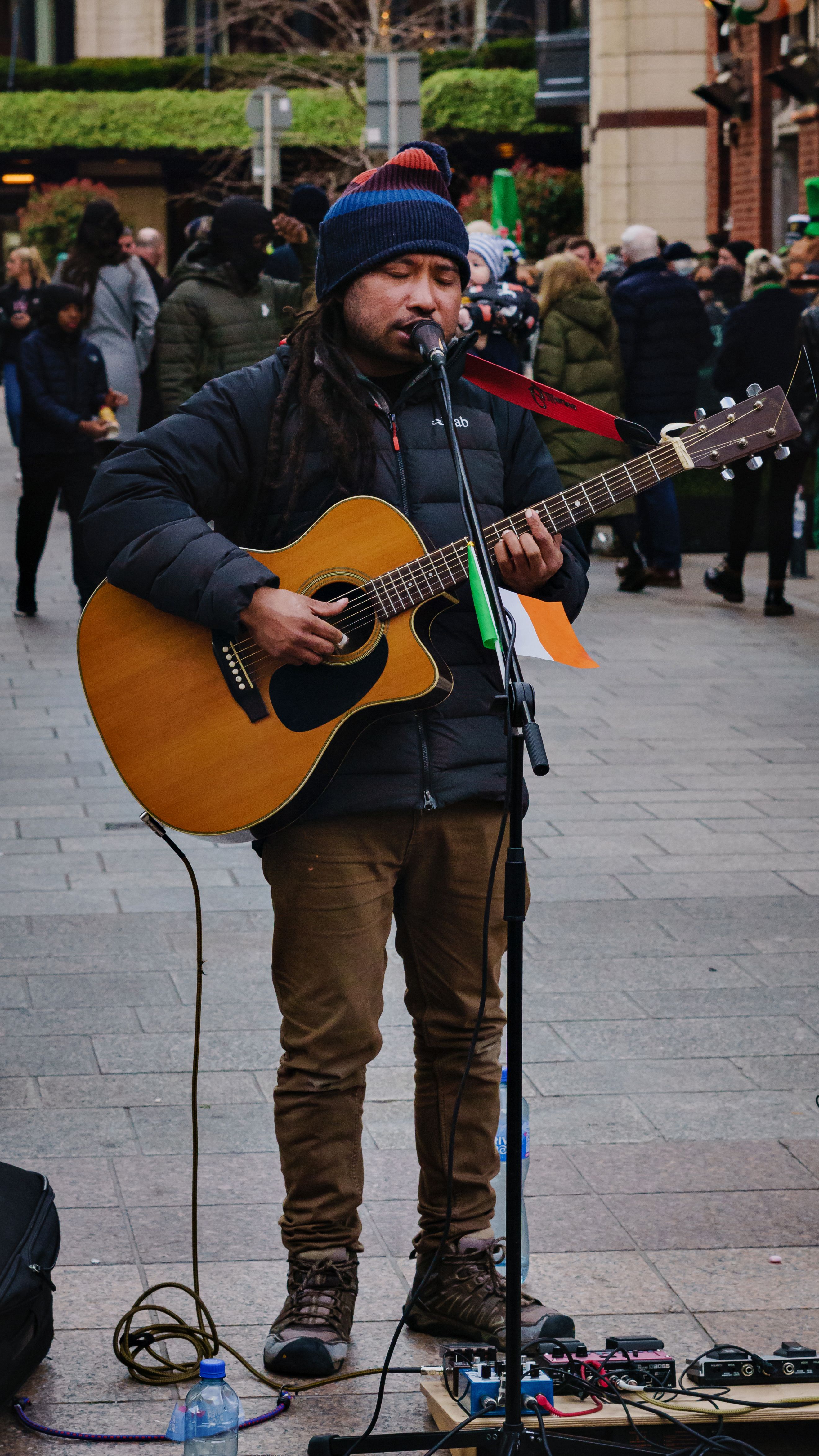 A Man Playing Guitar on the Street · Free Stock Photo