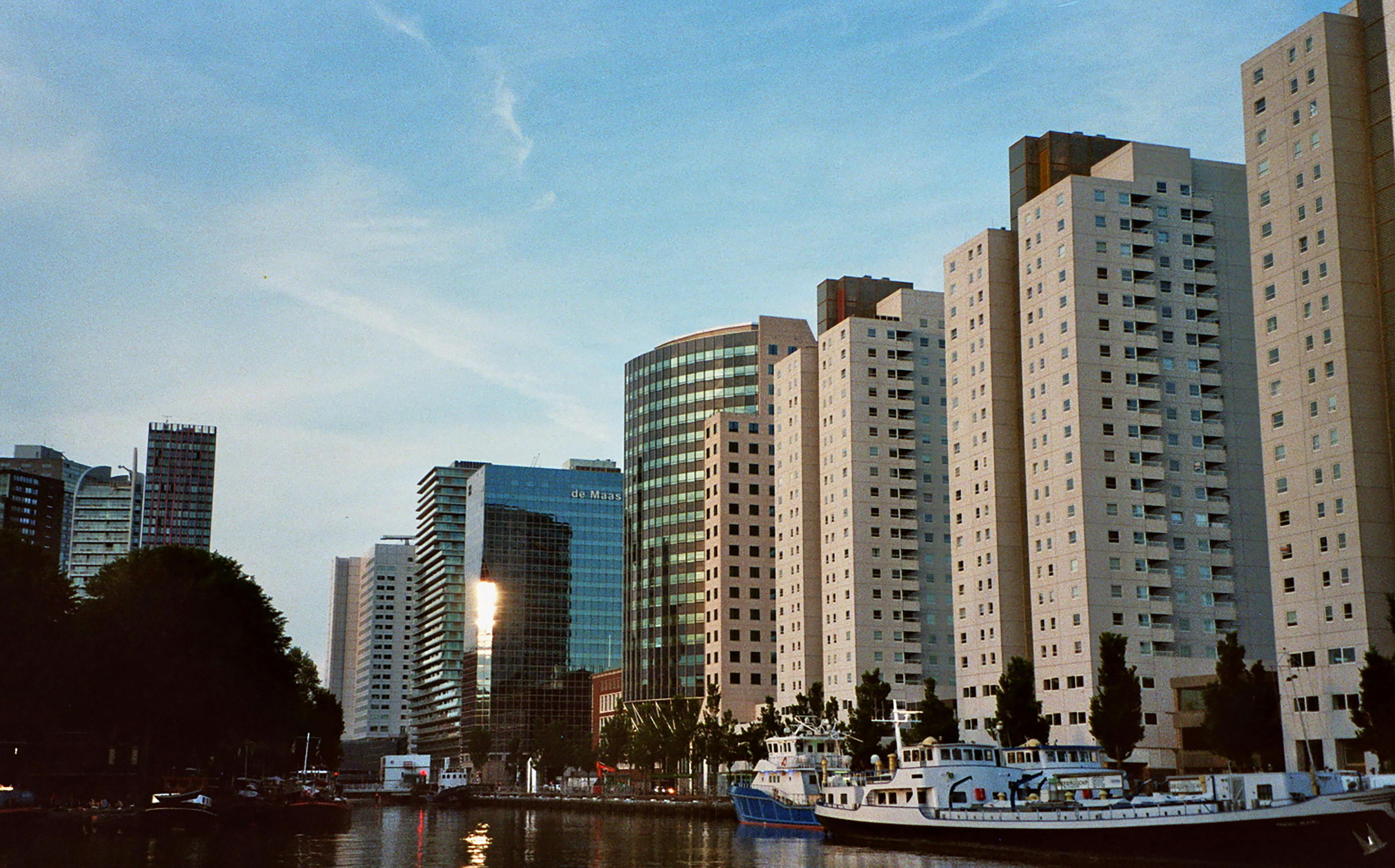 city buildings under the blue sky