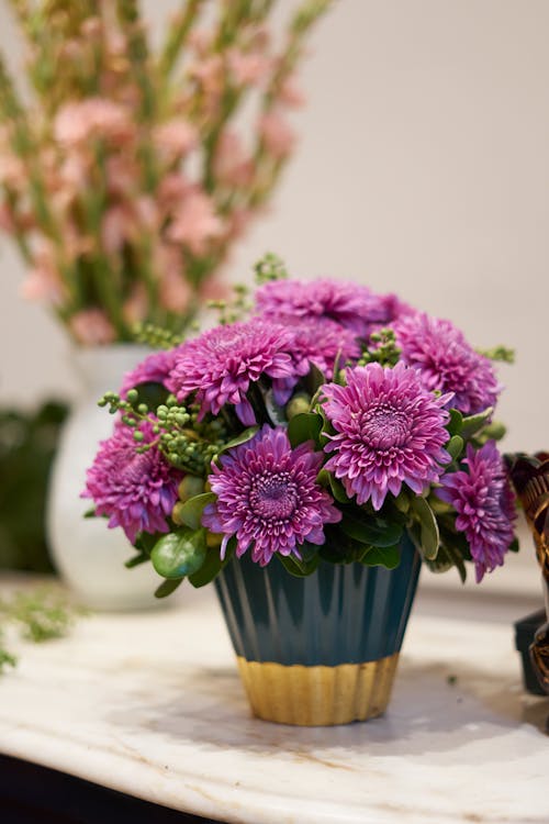 Close-Up Shot of Chrysanthemums on a Plastic Vase